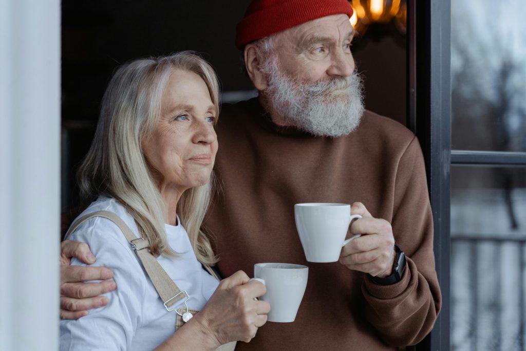 pexels-photo-7330130-7330130 A senior couple embraces while enjoying coffee, symbolizing love and companionship.